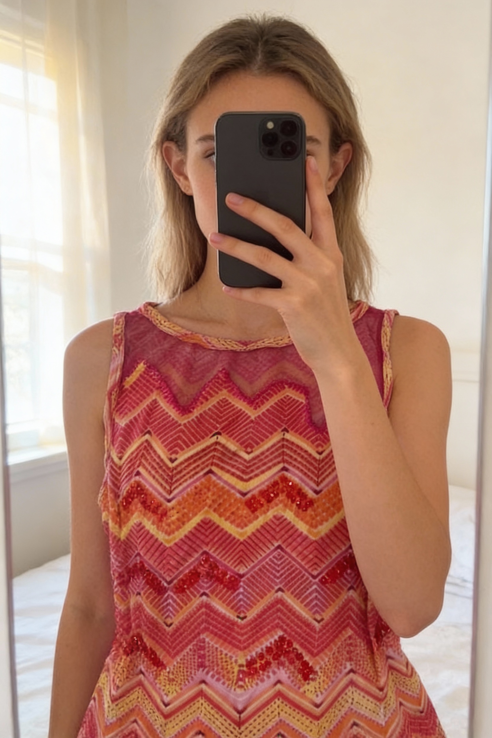 Vintage Y2K pink orange yellow sequin vest tank top standing straight facing the camera, in a softly lit bedroom setting, with gentle natural light filtering through a window.