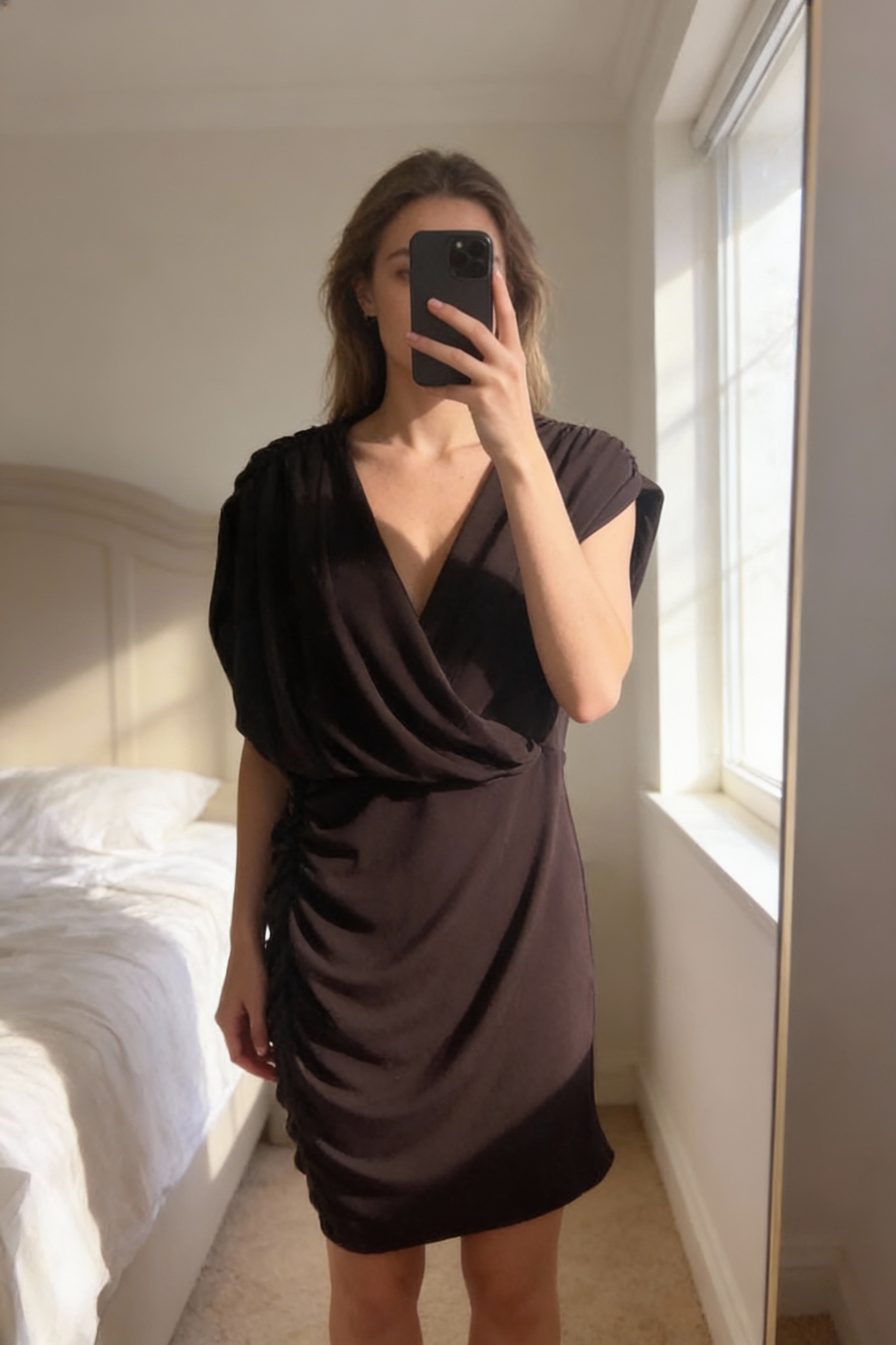 Zara BNWT brown mini dress standing straight facing the camera, in a softly lit bedroom setting, with gentle natural light filtering through a window.