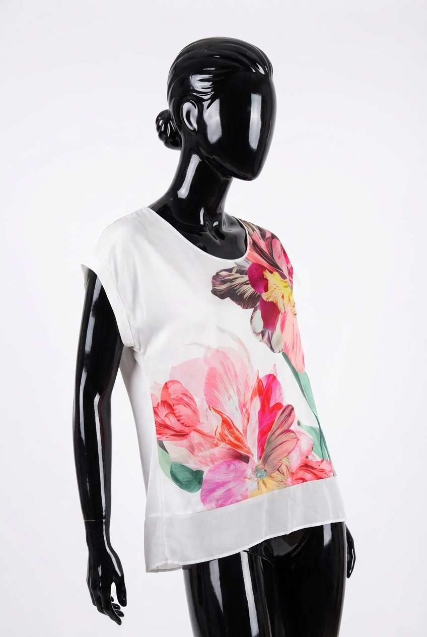 a glossy black plastic mannequin with no facial features in Coast Short Sleeved Top size 16 arching their back slightly for a dynamic pose, in a clean photo studio with seamless white backdrop and softbox lighting.