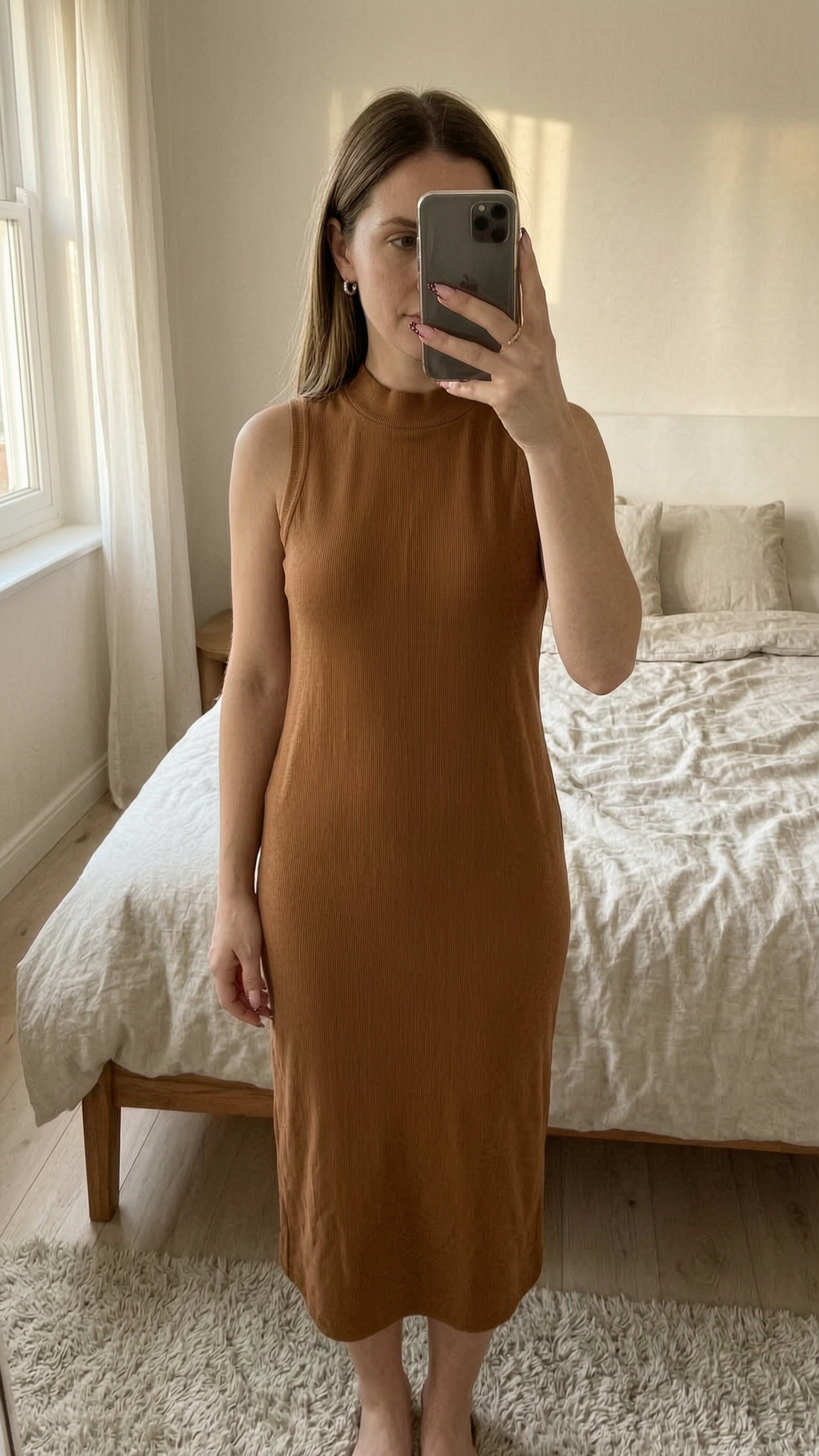 barna egyberuha standing straight facing the camera, in a softly lit bedroom setting, with gentle natural light filtering through a window.