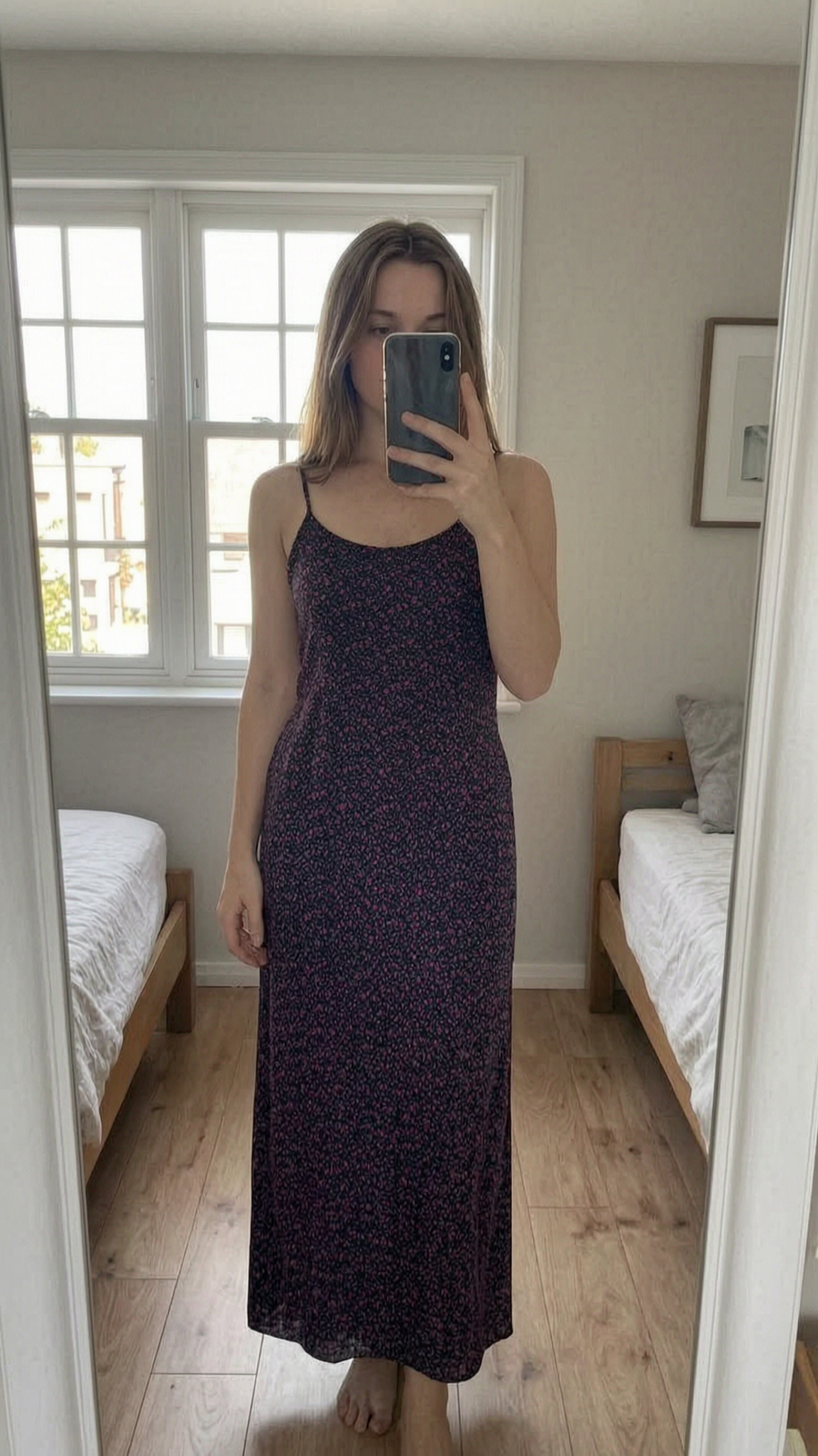 Boohoo summer maxi dress size 12 standing straight facing the camera, in a softly lit bedroom setting, with gentle natural light filtering through a window.