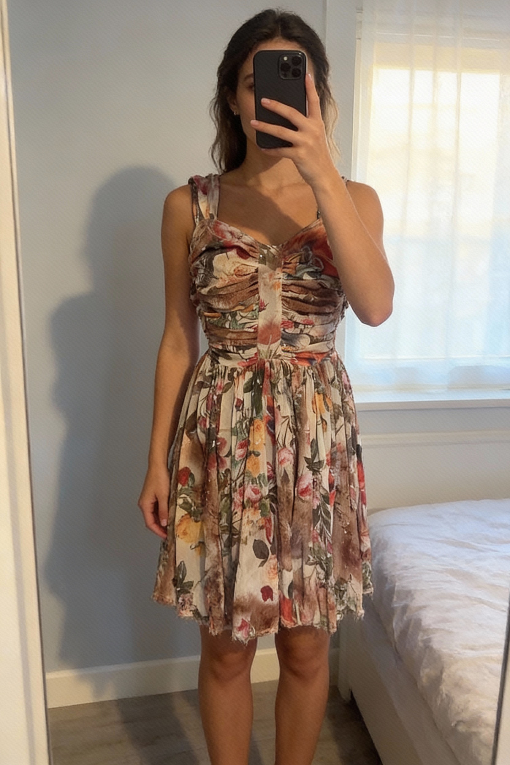 A person in Allsaints dress size 8 standing straight facing the camera, in a softly lit bedroom setting, with gentle natural light filtering through a window.