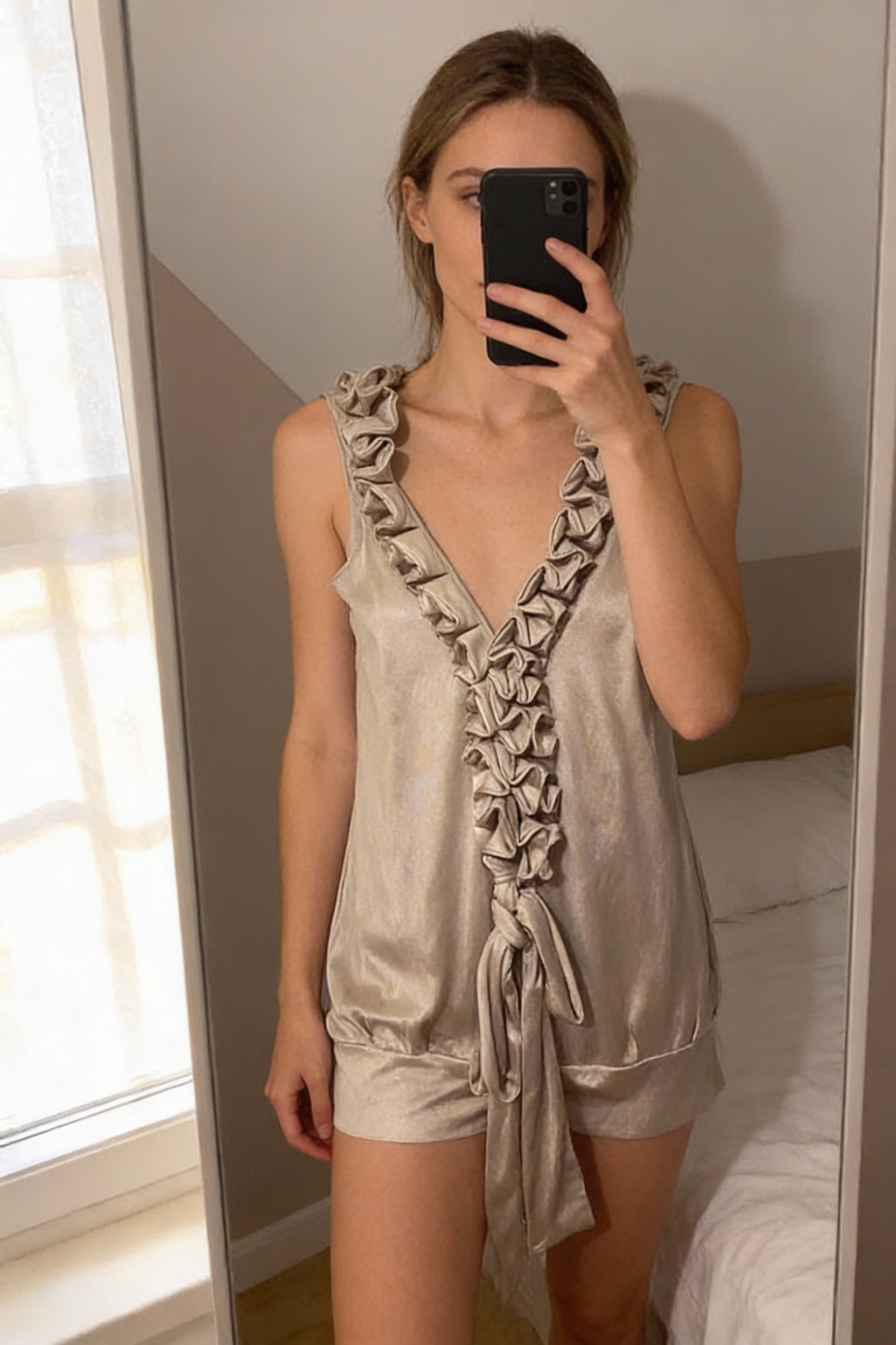 Aqua Gold Dress standing straight facing the camera, in a softly lit bedroom setting, with gentle natural light filtering through a window.