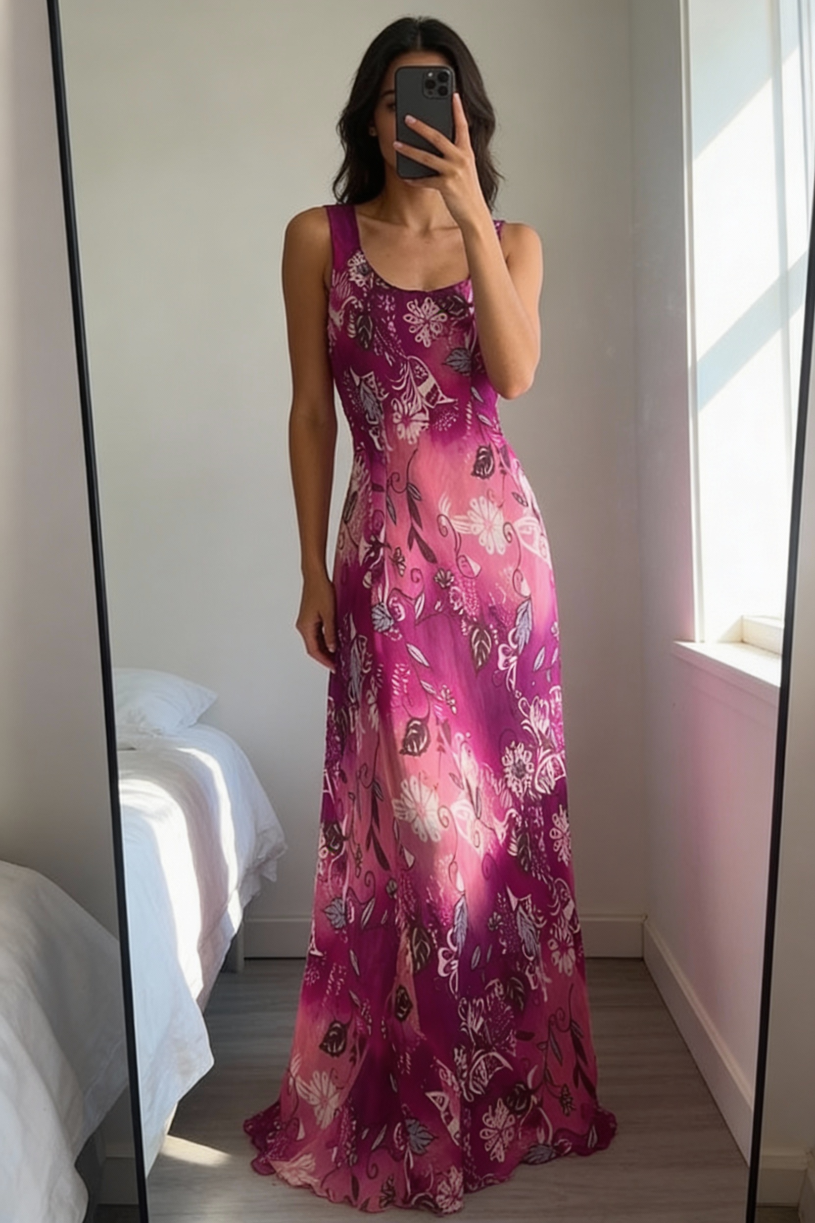 A person in Vintage Y2K per Una pink and purple floral floaty long dress standing straight facing the camera, in a softly lit bedroom setting, with gentle natural light filtering through a window.