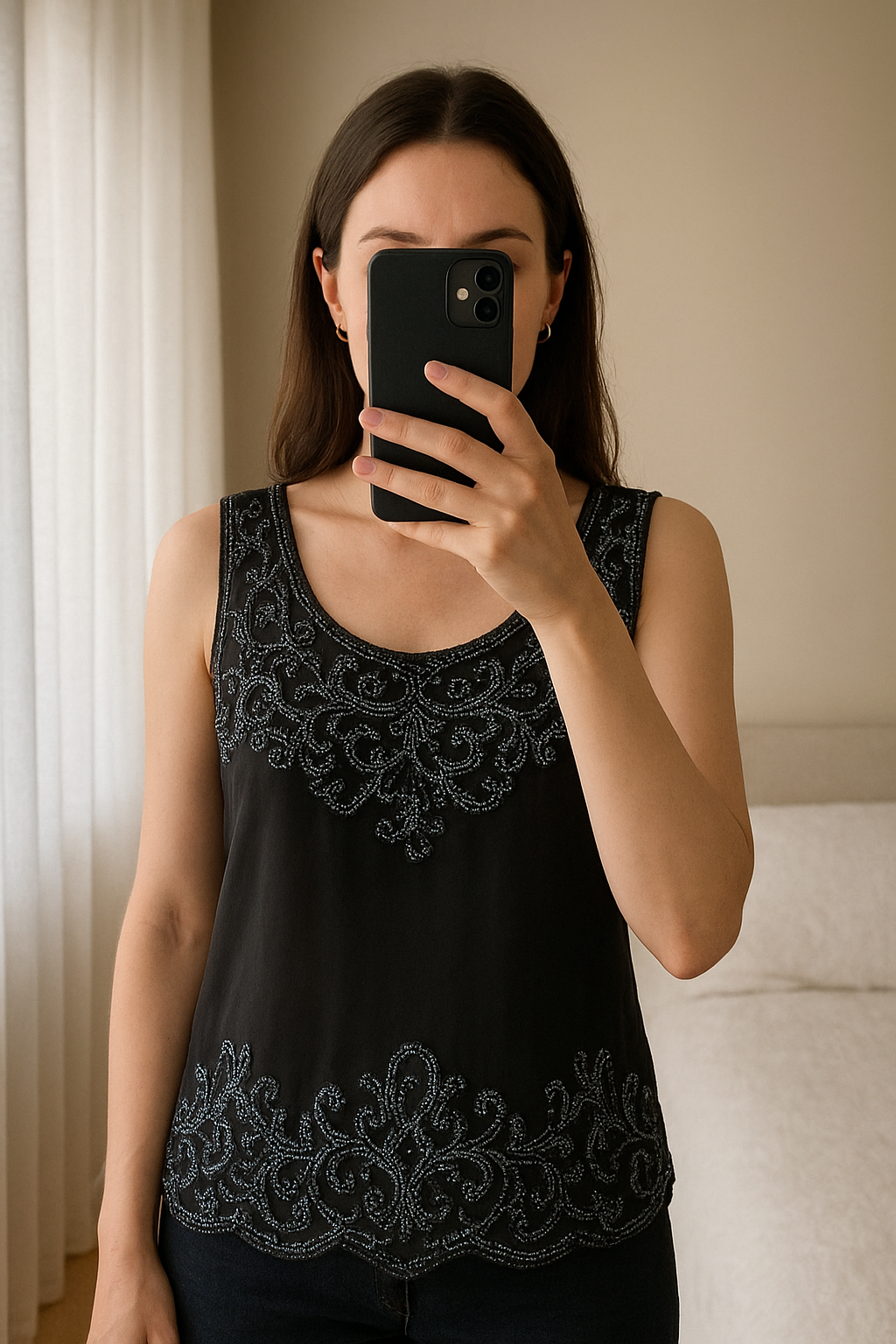 Navy embellished top top. Size 16. Dorothy Perkins. New with tags. standing straight facing the camera, in a softly lit bedroom setting, with gentle natural light filtering through a window.