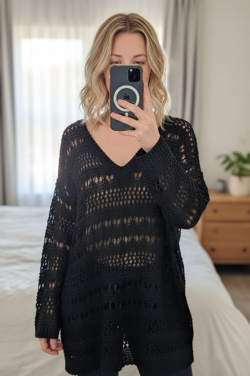 Simply Be Black Crochet Knit Jumper Boho Festival Beach Cover Up UK16 18 v neck cottagecore standing straight facing the camera, in a softly lit bedroom setting, with gentle natural light filtering through a window.